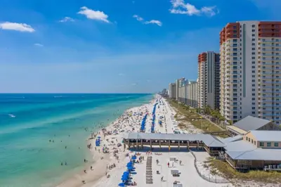 an aerial view of a beach with buildings and the ocean at Shores of Panama 1426 condo in Panama City Beach