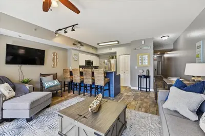 a living room with a couch and a table at Shores of Panama 1708 condo in Panama City Beach