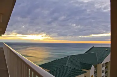 a view of the ocean from the balcony of a building at Shores of Panama 1708 condo in Panama City Beach