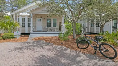 a bike parked in front of a house at KK's Beach House - Newly remodeled, close to Seaside, easy walk to beach in Santa Rosa Beach
