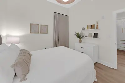 a white bedroom with a white bed and a white cabinet at Emerald By Alma - Updated 3BD 2BA condo Seagrove Highlands in Santa Rosa Beach