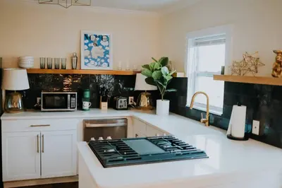 a kitchen with a stove top on a counter at Dream On – Style & Comfort Near Historic Downtown in Panama City