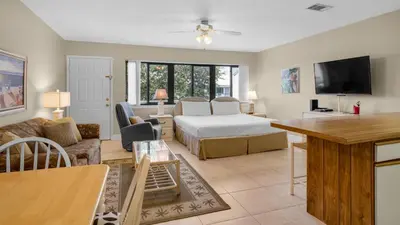 a large living room with a bed and a couch at Hidden Beach 235 in Santa Rosa Beach