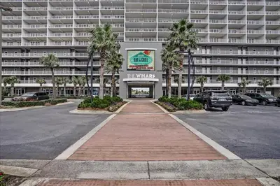 a parking lot in front of a large apartment building at Laketown Wharf #119 by Nautical Properties in Panama City Beach
