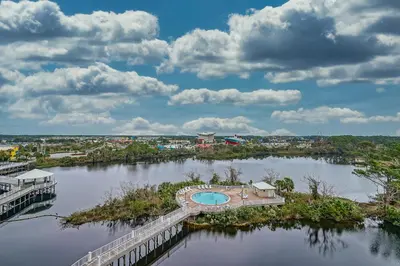 an aerial view of a river with a bridge at Laketown Wharf #119 by Nautical Properties in Panama City Beach