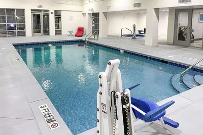 a large swimming pool in a building at Wingate by Wyndham Panama City Area Lynn Haven in Panama City