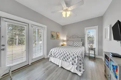 a bedroom with a bed and a ceiling fan at Seashine and Sunkises - Great pricing near Seaside in Santa Rosa Beach