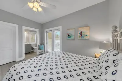 a bedroom with a bed and a ceiling fan at Seashine and Sunkises - Great pricing near Seaside in Santa Rosa Beach