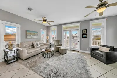 a living room with a couch and chairs and a ceiling fan at Seashine and Sunkises - Great pricing near Seaside in Santa Rosa Beach