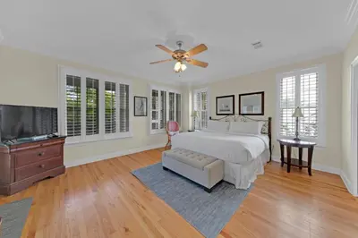a bedroom with a bed and a flat screen tv at Memory Maker II - Modern Home with 4Bedrooms and 3 and a half baths in Seagrove Beach along 30a in Santa Rosa Beach
