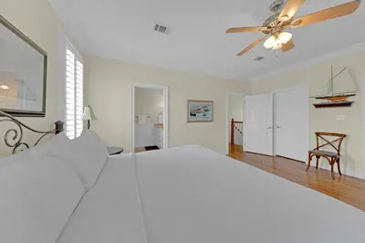 a white bedroom with a bed and a ceiling fan at Memory Maker II - Modern Home with 4Bedrooms and 3 and a half baths in Seagrove Beach along 30a in Santa Rosa Beach