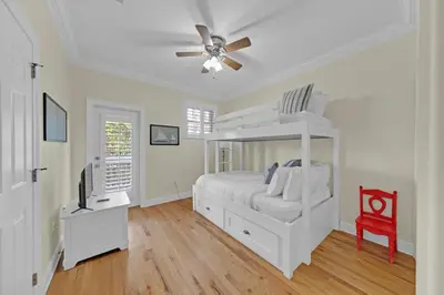 a white bedroom with a bed and a ceiling fan at Memory Maker II - Modern Home with 4Bedrooms and 3 and a half baths in Seagrove Beach along 30a in Santa Rosa Beach