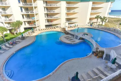 a large swimming pool in front of a hotel at Dunes of Seagrove 301B - Updated decor with Great views and Beach service included March through October in Santa Rosa Beach