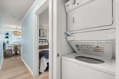 a white washer and dryer in a small bathroom at Beachside Villas #312 in Santa Rosa Beach