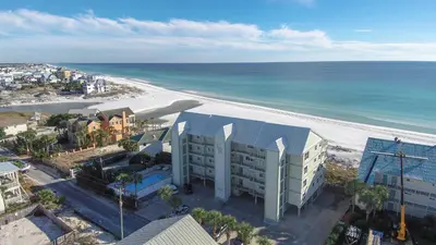 an aerial view of a building and the beach at Commodore's Retreat 402 - Beach service included 2 chairs and 1 umbrella March through October in Santa Rosa Beach
