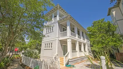 a white house with a stop sign in front of it at Top of the Dunes - Recently Redecorated Short walk to the Beach in Santa Rosa Beach