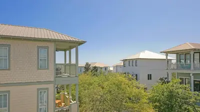 a group of buildings with trees in front of them at Top of the Dunes - Recently Redecorated Short walk to the Beach in Santa Rosa Beach