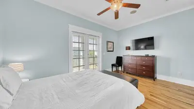 a bedroom with a bed and a ceiling fan at Top of the Dunes - Recently Redecorated Short walk to the Beach in Santa Rosa Beach