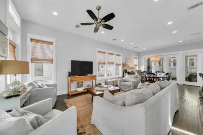 a living room with couches and a flat screen tv at Seagrove Serenity - Seagrove Beach 30a 3BD 3BA Home in Santa Rosa Beach