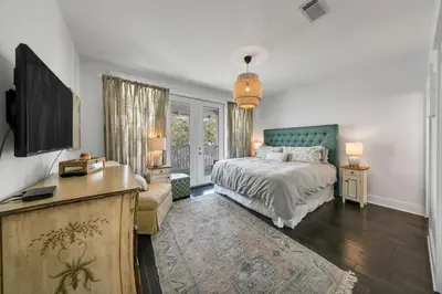 a bedroom with a bed and a tv in it at Seagrove Serenity - Seagrove Beach 30a 3BD 3BA Home in Santa Rosa Beach