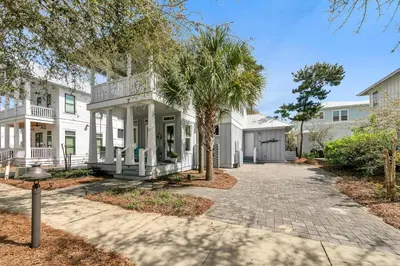 a white house with a palm tree and a driveway at Seagrove Serenity - Seagrove Beach 30a 3BD 3BA Home in Santa Rosa Beach