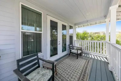 a porch with two benches on a house at Seagrove Serenity - Seagrove Beach 30a 3BD 3BA Home in Santa Rosa Beach