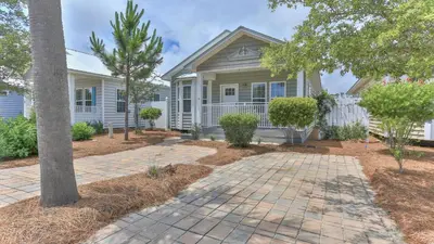 a house with a tree in front of it at Elsie's Cove - Close to the Beach in Seagrove along 30A in Santa Rosa Beach
