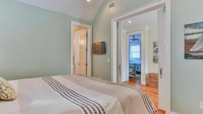 a bedroom with a large bed in a room at Family Ties - Located in Seacrest Beach 2 Master bedrooms and a large communal pool in Rosemary Beach