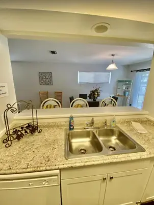 a kitchen with a sink and a counter top at Dolphin house with Private Pool and Near Beach in Panama City Beach