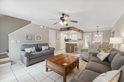 a living room with a couch and a table at Gulf Highlands #106 in Panama City Beach