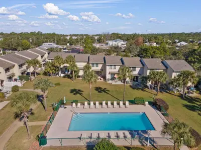 an aerial view of a home with a swimming pool at Gulf Highlands #106 in Panama City Beach