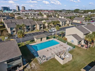 an aerial view of a house with a swimming pool at Gulf Highlands #106 in Panama City Beach