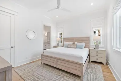 a white bedroom with a large bed and windows at Summer Villa - 274 Pompano Street home in Inlet Beach
