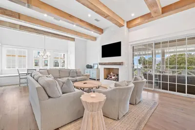 a living room with a couch and a fireplace at Summer Villa - 274 Pompano Street home in Inlet Beach