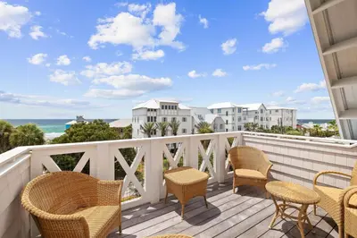 a balcony with chairs and a view of the ocean at Summer Villa - 274 Pompano Street home in Inlet Beach