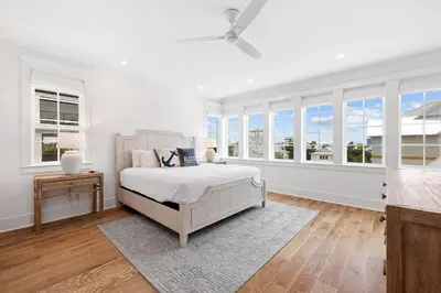 a white bedroom with a bed and windows at Summer Villa - 274 Pompano Street home in Inlet Beach