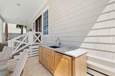 a kitchen with a sink on a patio at Summer Villa - 274 Pompano Street home in Inlet Beach