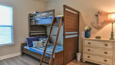 a bunk bed in a bedroom with a bunk bed in a room at After Dune Delight - 3 blocks to the beach less than a mile to Seaside! in Santa Rosa Beach