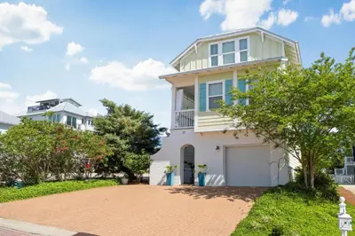 a house with a driveway in front of it at 30A Pet Friendly Beach House - Pelican's Rest by Panhandle Getaways in Rosemary Beach