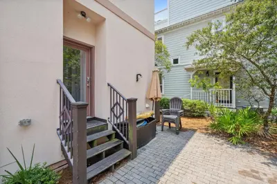 a stairway leading to a house with a patio at 30A Beach House - Beach Bikin by Panhandle Getaways in Panama City Beach