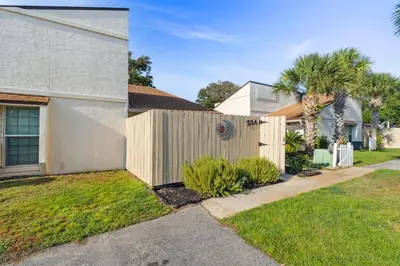 a wooden fence in front of a house at Horizon South 23A by InJoy Vacations in Panama City Beach