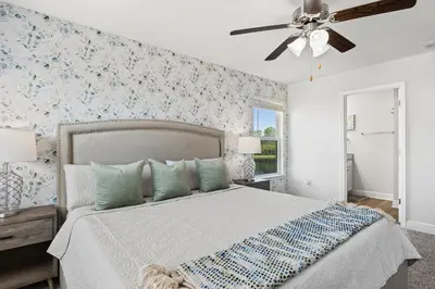 a bedroom with a bed and a ceiling fan at NEW ⁂Serenity Beach⁂ Lakefront 3BRs Close to Beach in Panama City Beach