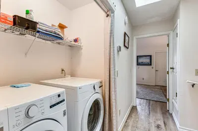 a laundry room with a washer and dryer at PCB Townhome with Resort Amenities - Walk to Ocean! in Panama City Beach