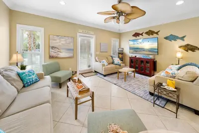 a living room with a couch and chairs at Summer Special, Lux 4BR House Sleeps 12, Pool, Elevator, King bed in Panama City Beach