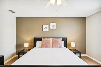 a bedroom with a large bed with two night stands at Babberville 11818 By Book That Condo in Panama City Beach