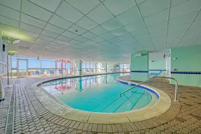 a large swimming pool in a large building at Stunning Ocean & Sunset Views, Direct Beach Access with 2 King Bedrooms at Panama City Beach, Fl in Panama City Beach