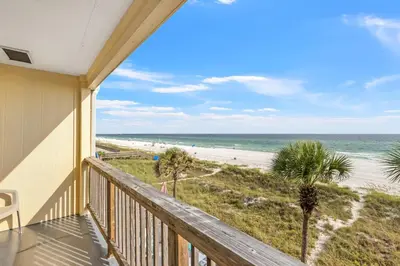 a balcony with a view of the beach at 2BD/25BA Gulf Front Townhome near Pier Park! Gulf Views! Beach Access! in Panama City Beach