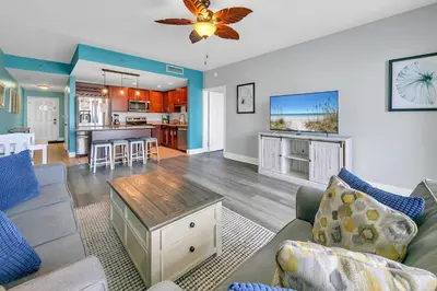 a living room with a couch and a table at Laketown Wharf 607 in Panama City Beach