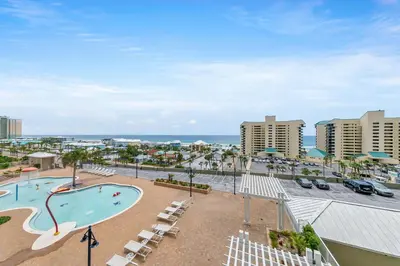 a view of a pool and the ocean from a resort at Laketown Wharf 607 in Panama City Beach