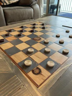 a chessboard on a wooden table on a table at Updated Beach Condo at the Shores of Panama Condos - Unit 918 in Panama City Beach